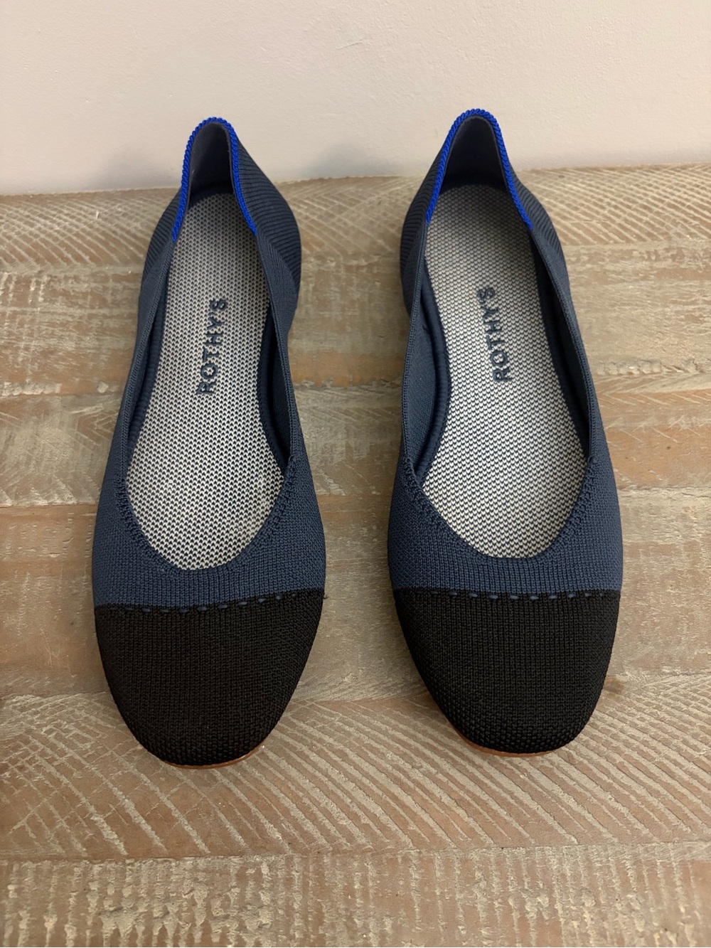 Rothy's Navy and Black Knit Slip-On Flats with Blue Heel Trim